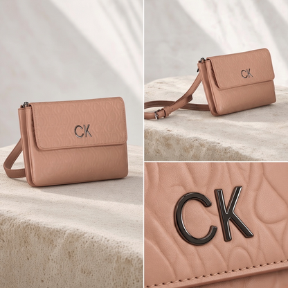 Bolso bandolera liquidationlive Calvin Klein en color rosa con logo metálico CK y textura grabada en la solapa