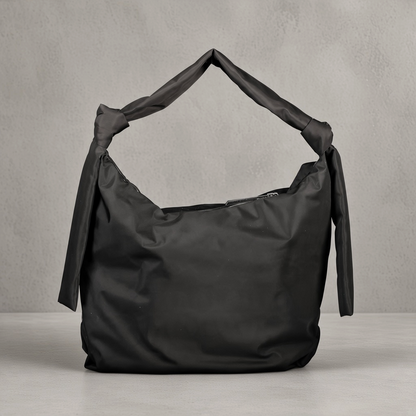 Bolso de hombro negro liquidationlive con asa anudada y tiras laterales decorativas en diseño minimalista