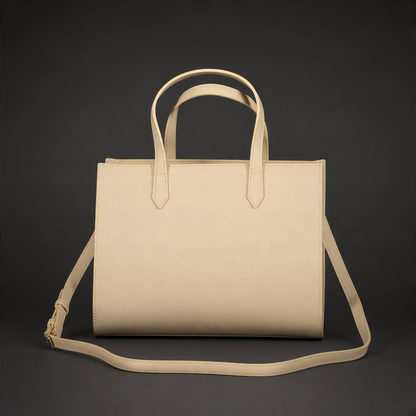 Bolso de mano liquidationlive en color beige con doble asa y correa bandolera ajustable sobre fondo oscuro