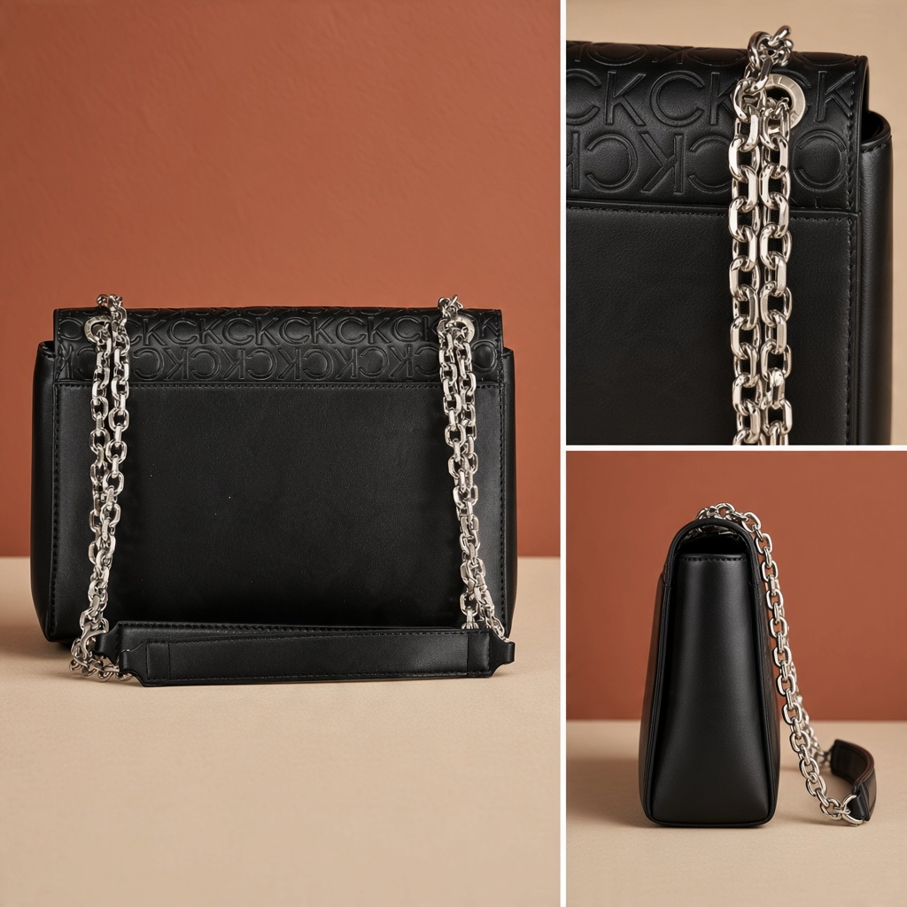 Bolso negro Calvin Klein de liquidationlive con solapa texturizada, iniciales en relieve y asas de cadena plateada.