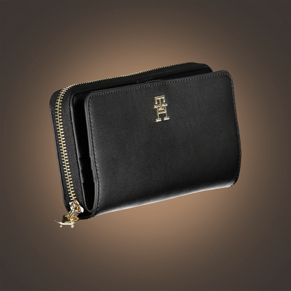 Cartera negra Tommy Hilfiger de liquidationlive con cremallera dorada y logotipo metálico en la parte frontal
