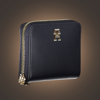 Cartera negra Tommy Hilfiger para mujer con cierre de cremallera dorada y logotipo metálico de la marca liquidationlive
